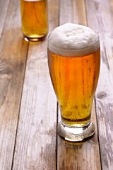 Refreshing Pour: Close-Up of Pouring and Serving Cold Beer into a Glass, Showcased in Crisp 4K Resolution