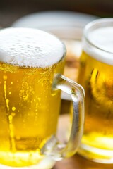 Refreshing Pour: Close-Up of Pouring and Serving Cold Beer into a Glass, Showcased in Crisp 4K Resolution