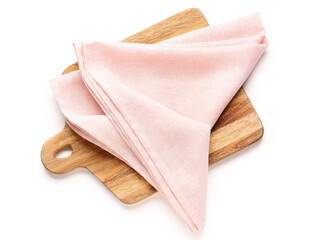 Wooden board and pink napkin on white background