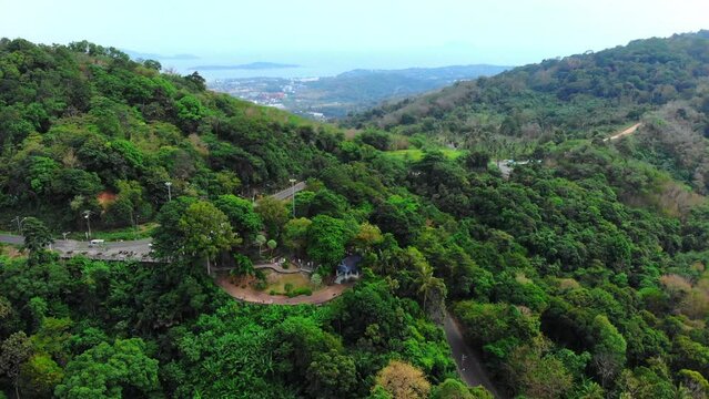 Aerial shot of Karon View Point, sea, green mountains, tropical plants, trees. Exterior view of the observation deck, beautiful nature of Thailand Phuket, tropics, bird's eye view. High quality 4k