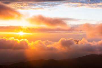 The sun rising over the mountain range.