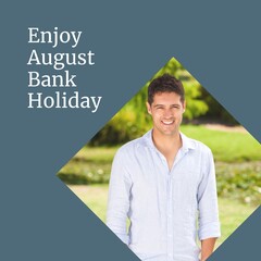Enjoy august bank holiday text on blue with happy caucasian man in park on sunny day