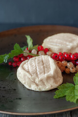 Goat cheese Coulommiers , brie, camembert from Russian farmers. Cheese is served with fruit