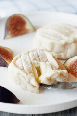 Goat cheese Coulommiers , brie, camembert from Russian farmers. Cheese is served with fruit