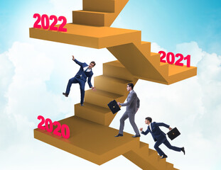 Businessman climbing stairs on yearly basis