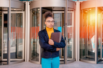 businesswoman wearing office suits with digital tablet,  waiting near the business centre.  business partners concept