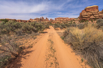 hiking the chesler park loop trail in the needles in canyonlands national park, usa