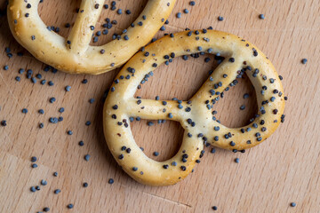 Poppy seed coating dried bagels on the table