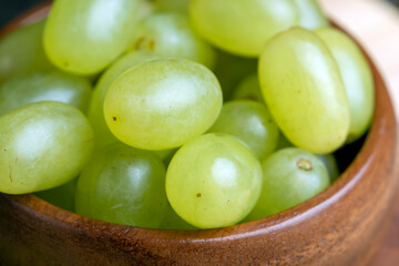 Homemade green unwashed grapes on a board