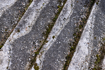 an old ruined concrete and stone staircase in the park