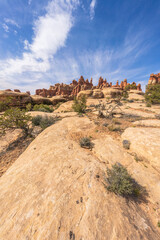 hiking the chesler park loop trail in the needles in canyonlands national park, usa