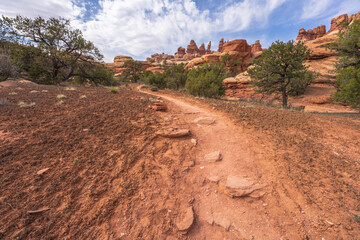 hiking the chesler park loop trail in the needles in canyonlands national park, usa