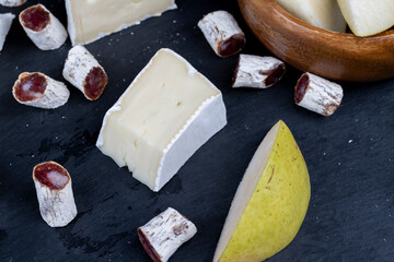 delicious sliced cheese with edible white mold