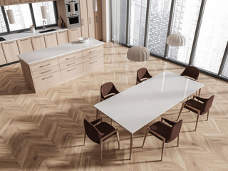 Top view of cozy home kitchen interior with dining and cooking space, window