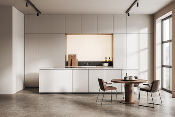 White kitchen interior with cabinets and dining table