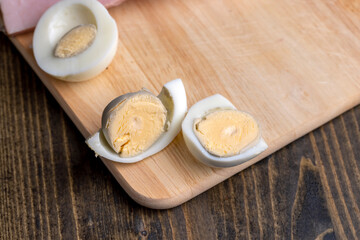 Boiled chicken egg with sliced pieces of meat