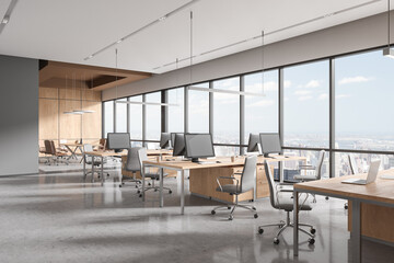 Stylish office interior with desk and chairs in row, meeting space near window