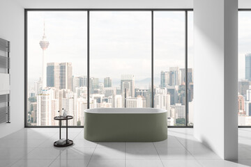 White hotel bathroom interior with bathtub and accessories, panoramic window