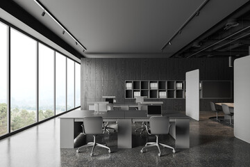 Workplace in gray coworking office interior