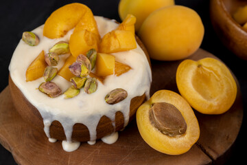 fresh yogurt with taste and chunks of yellow apricot