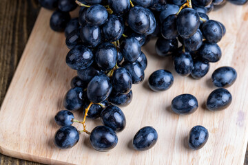 Unwashed blue grapes in the dust