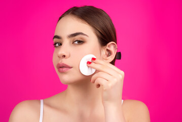 Obraz na płótnie Canvas Woman with cotton pad. Toner for cleaning make up. Clean healthy skin, studio background. Beauty woman holding cotton pad, applying cleansing lotion facial wipe on face, removing makeup.