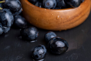 washed ripe black grapes covered with drops of water