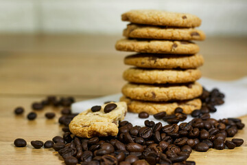 Coffee bean, homemade tasty cookies on cutting board