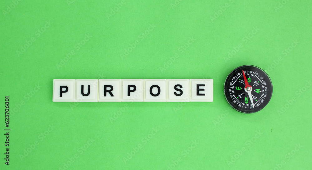 Poster compass and letters of the alphabet with the word purpose. the concept of purpose
