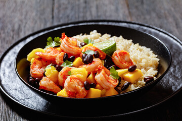 shrimps with beans, mango, brown rice in bowl