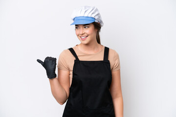 Fishmonger brazilian woman wearing an apron isolated on white background pointing to the side to present a product