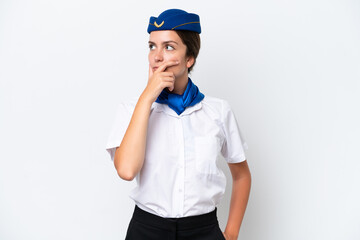 Airplane stewardess caucasian woman isolated on white background having doubts and with confuse face expression