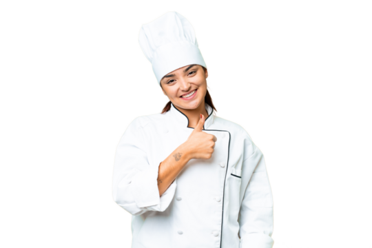 Young woman Chef over isolated chroma key background giving a thumbs up gesture