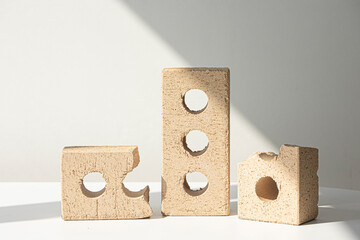beige brick block with holes