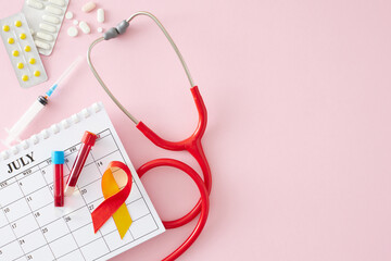 Health care on hepatitis day July 28th. Top view composition of calendar, stethoscope, pills, awareness ribbon, blood samples and syringe on light pink background with empty space for text