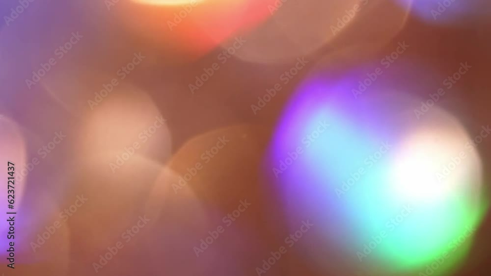 Wall mural gold bokeh shimmers with colorful tints shades. blurred bokeh lights particles abstract motion backg