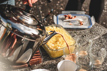 Desi Black Chai in glass mugs with traditional pakistani indian sweet