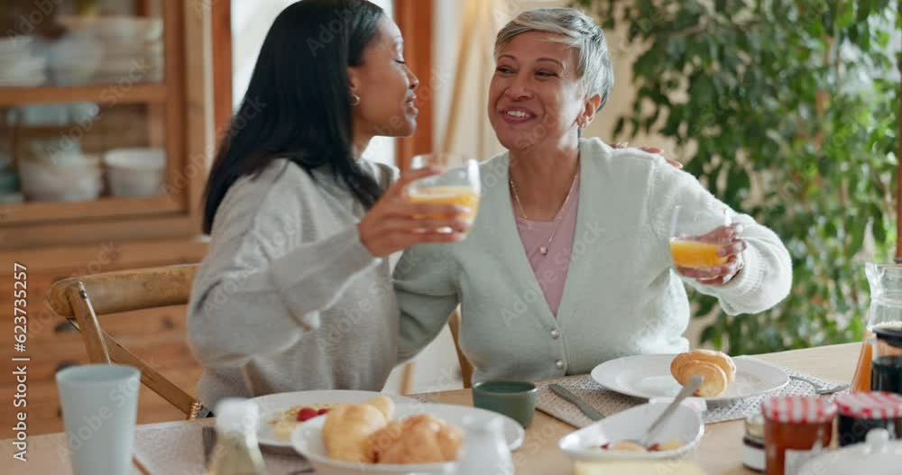 Poster Hug, women and breakfast cheers in a family home with orange juice at table for health and wellness. A mother, people or friends together in dining room with love, care and conversation about food