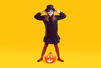 Full-size photo of funny teenager in Halloween costume on an isolated background in the studio....