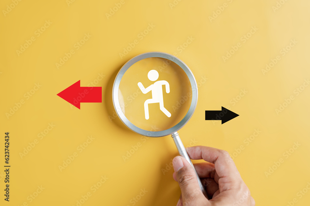 Aufkleber Businessperson following Red arrow and different direction facing opposite direction with black arrow for business disruption and technology transformation and different thinking idea concept.