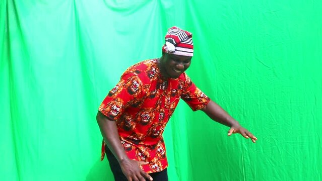 Nigerian man of Igbo tribe in Africa turns round in business elaborate victory dance presentation