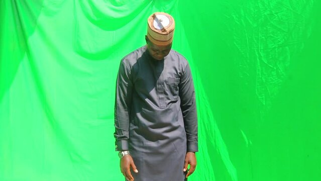 Dejected sad African human bends his head in bad mood, covers face with hand and walks off the stage in shame in a business gone wry