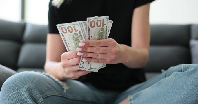 Woman hand counts hundred dollar bills closeup. Bribery banknote venality money laundering scheme