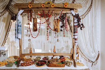 Cossack table in the best restaurants. Festive table at the wedding. National Ukrainian cuisine. Fat, sausages, alcohol. Catering.