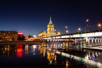 Night Moscow. View of the Moskva River, Novoarbatsky Bridge and the Ukraine Hotel at night. Moscow, Russia