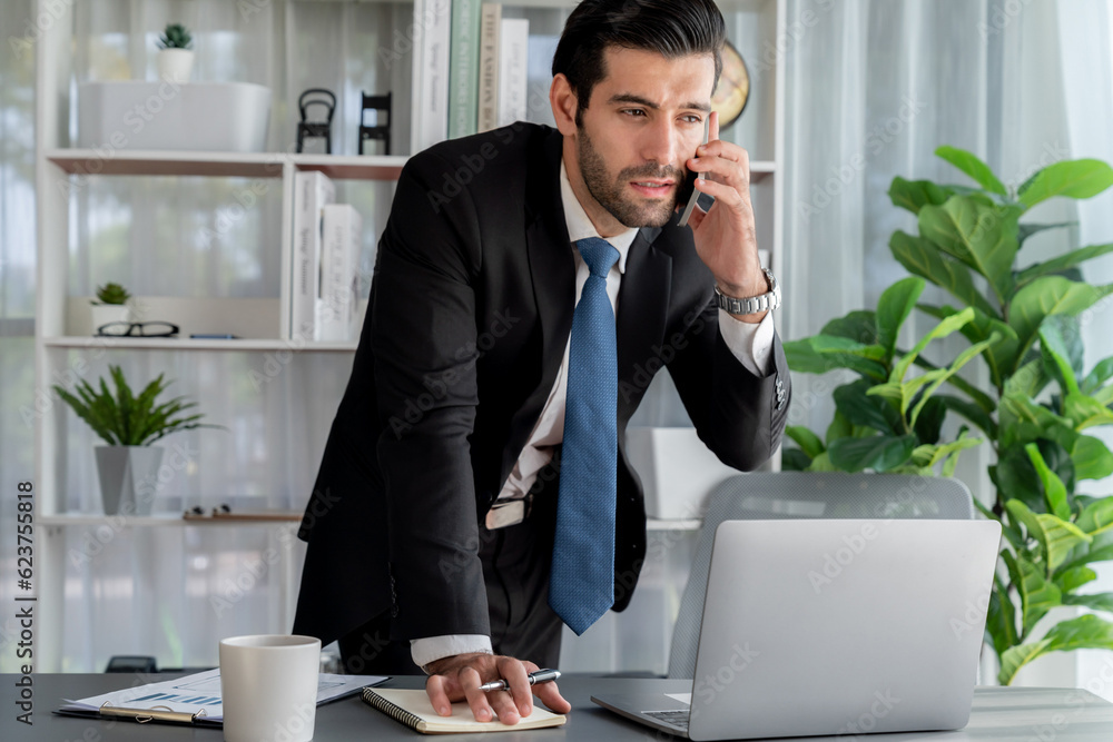 Aufkleber diligent businessman busy talking on the phone call with clients while working with laptop in his of