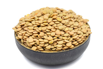 Green lentils isolated on white background. Raw green lentils in bowl