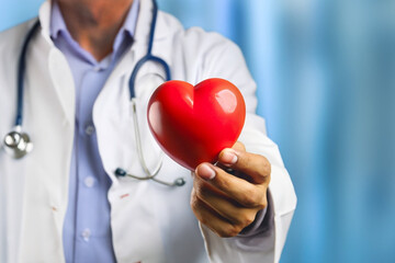 Medical heart cardiology concept. Medicine doctor holding red heart shape in hand.