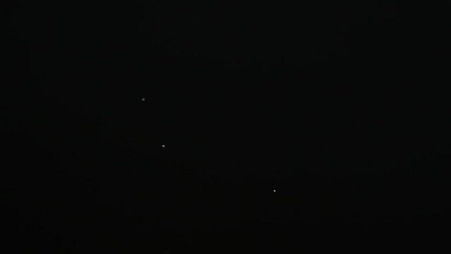 Aspartame powder falls on black surface. Artificial sweetener. Food additive E951, used as sugar substitute in food and beverages.