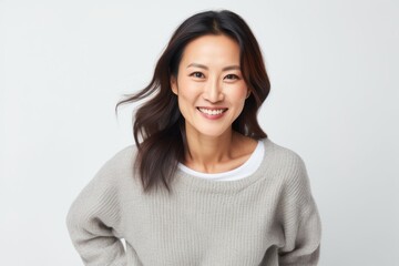 Portrait of a happy young asian woman smiling and looking at camera